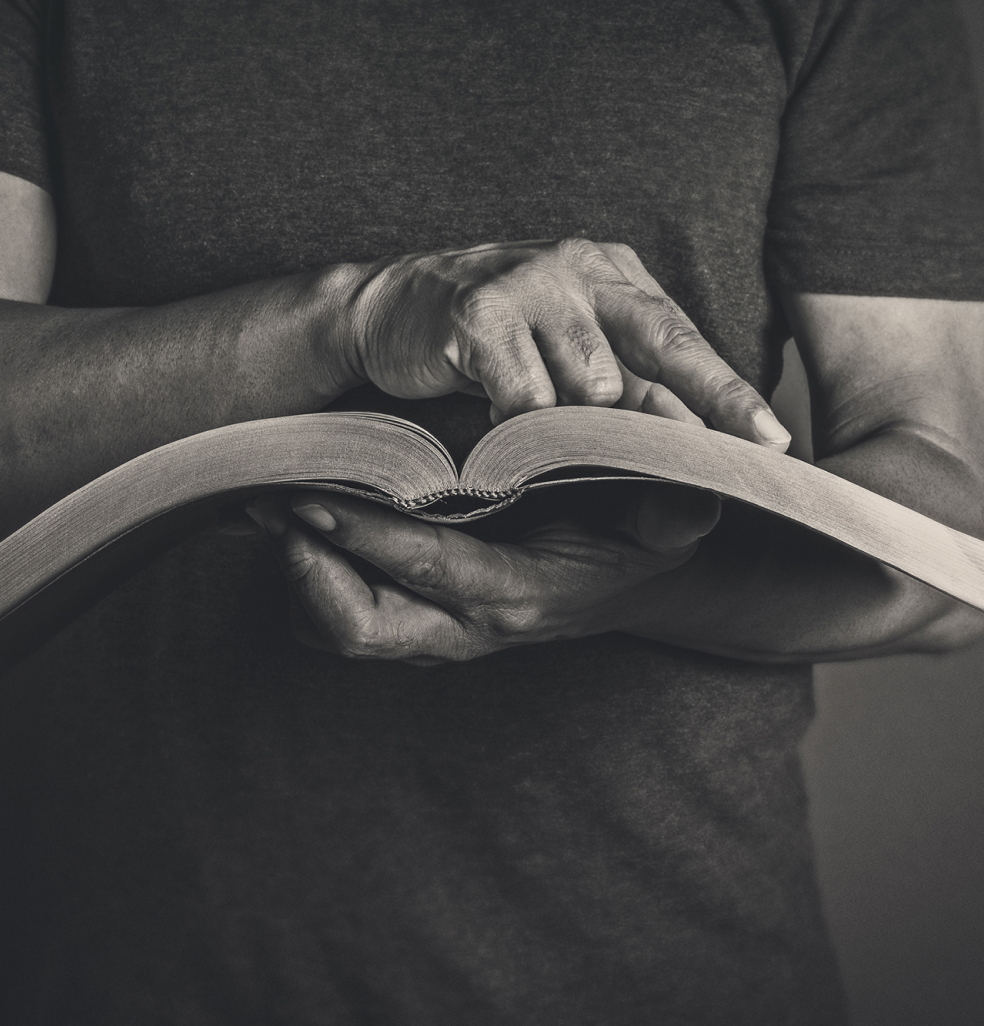 man reading a Bible