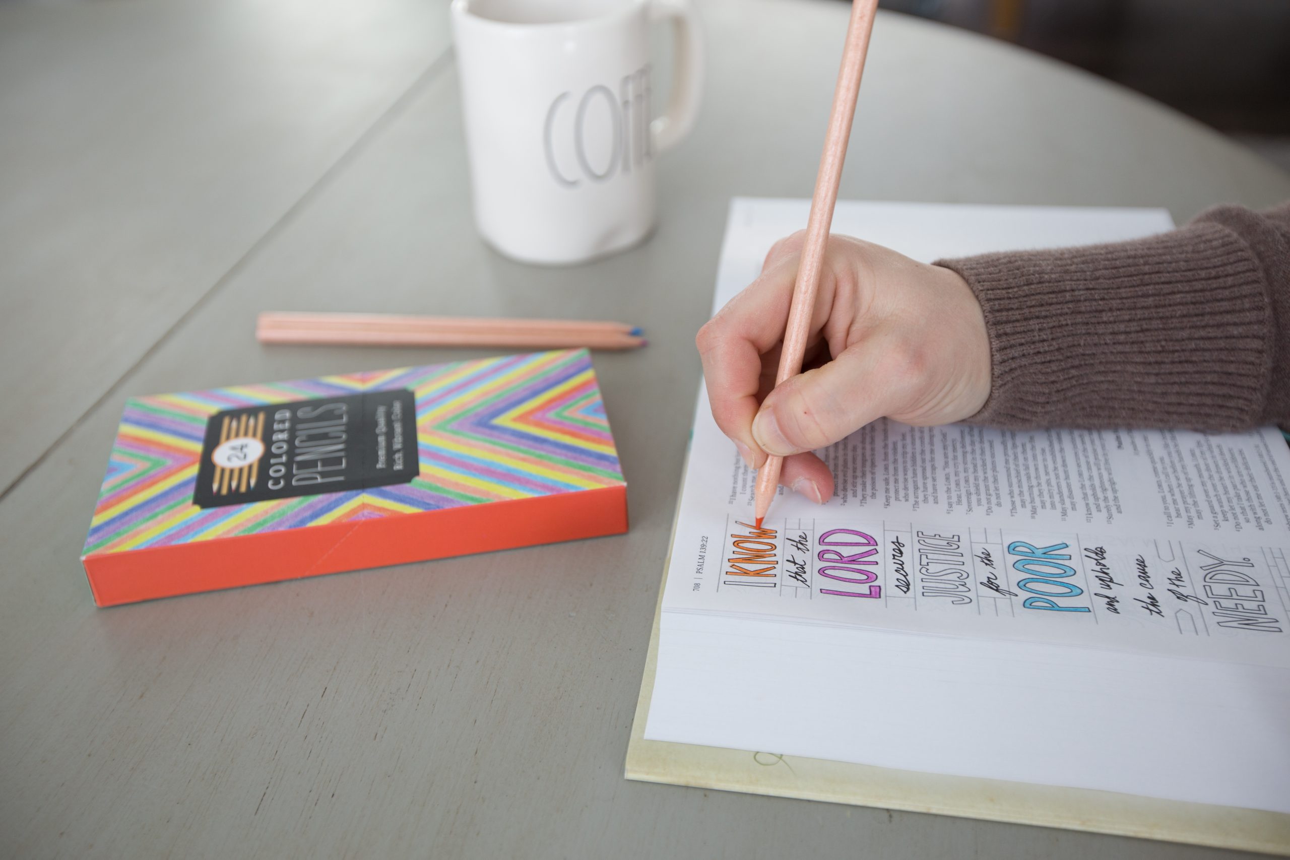 Person coloring in an NIV Journaling Bible