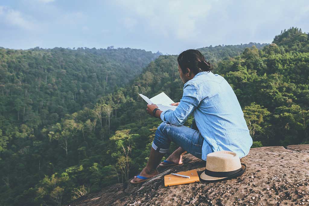 Man reading an NIrV Bible