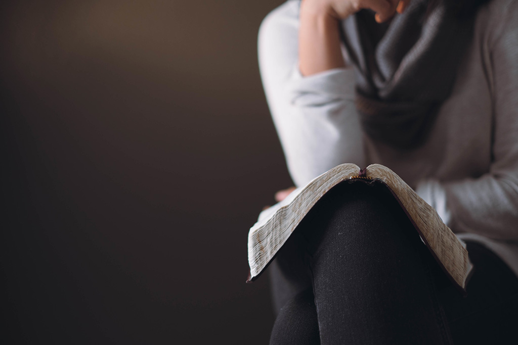 Woman reading the Bible
