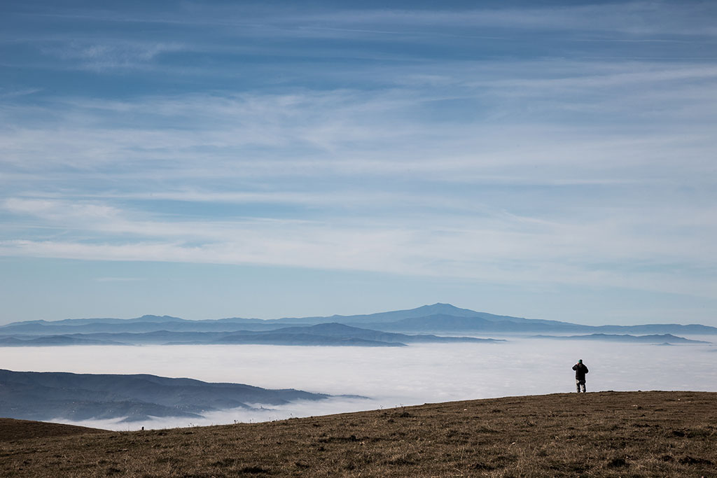 small man in a huge expanse of nature