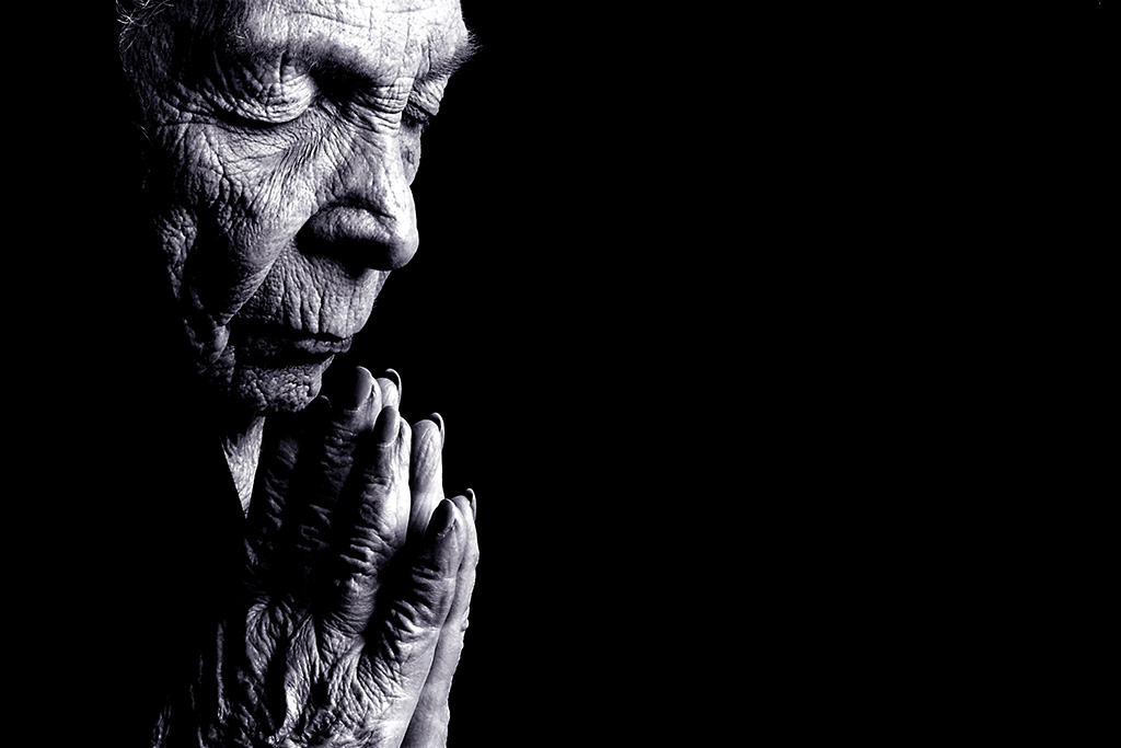 "Anna," an old woman, in prayer