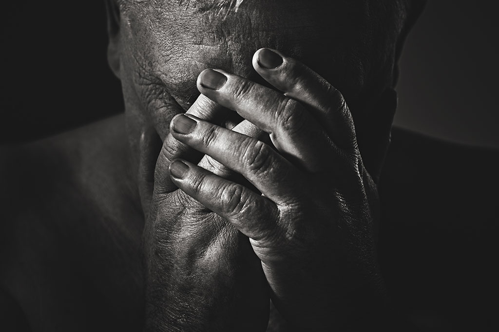 Suffering man in prayer
