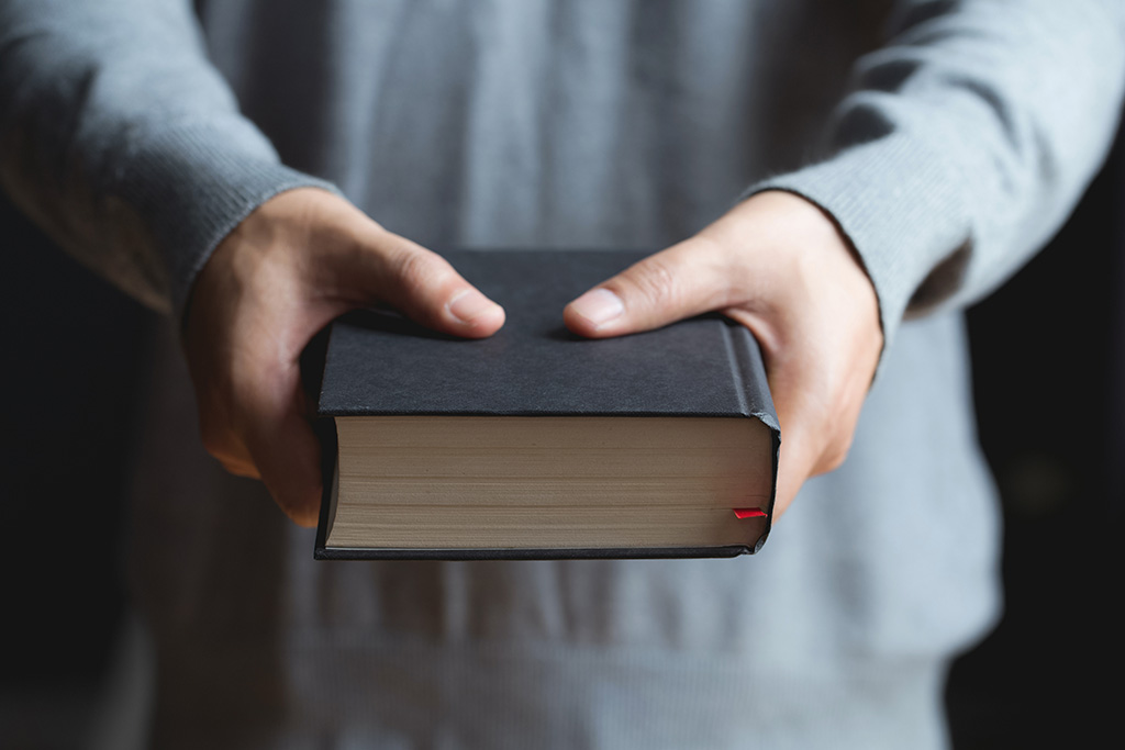 Man holding a Bible