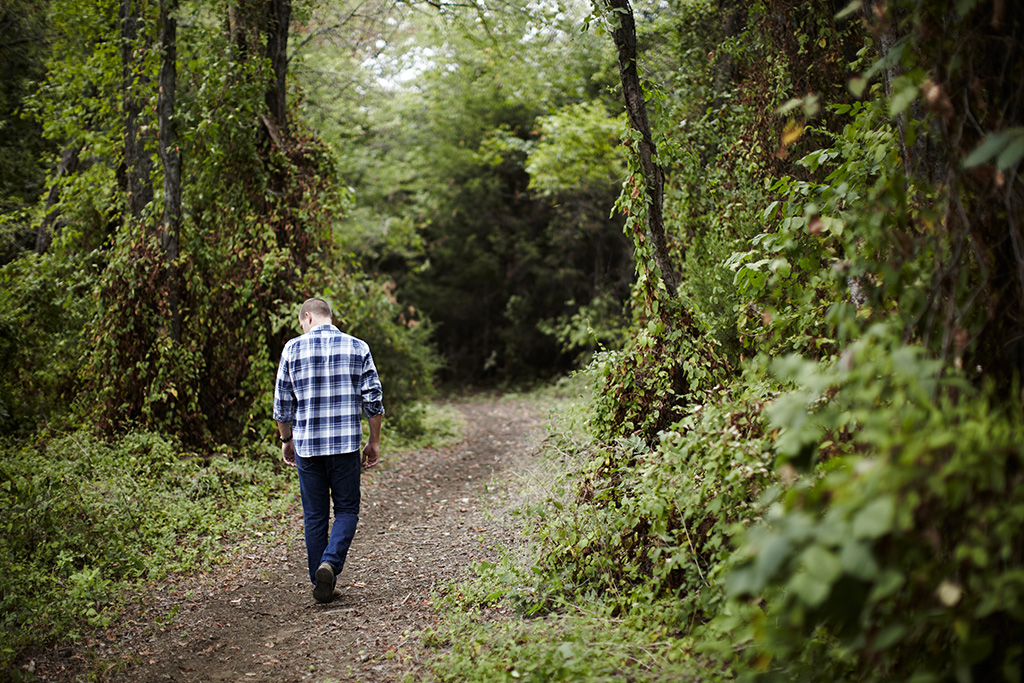Man practicing solitude in the forest