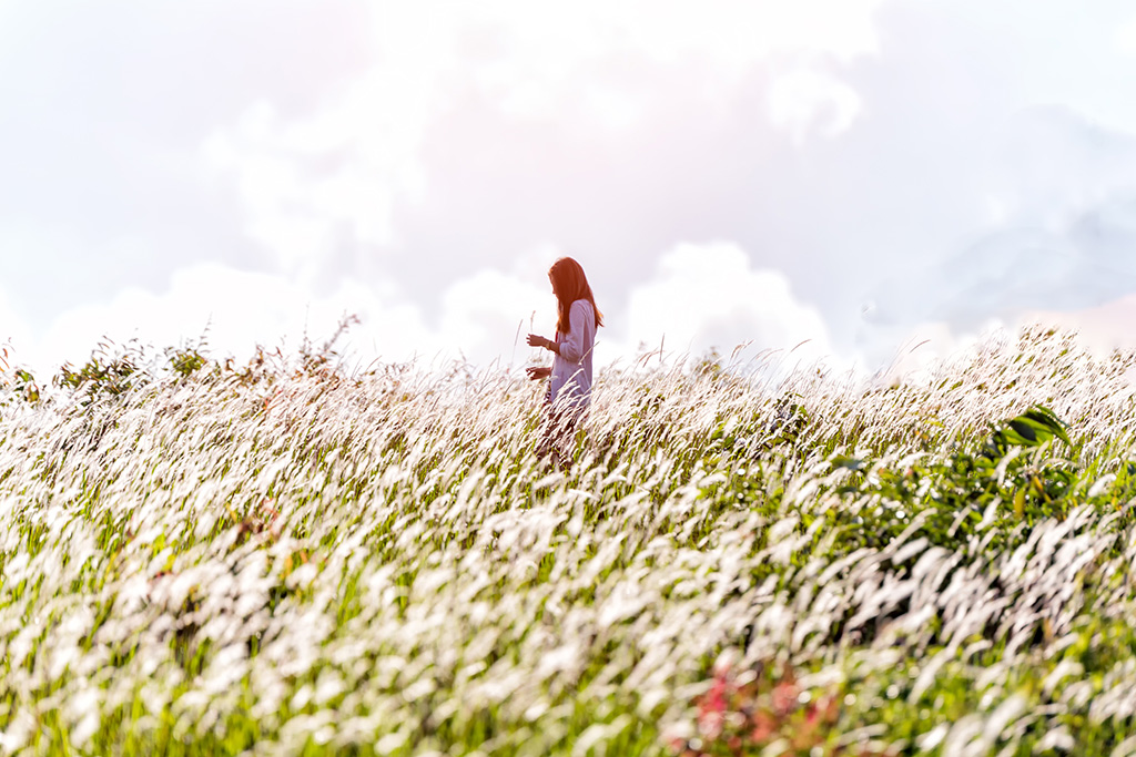 woman free from worry in field