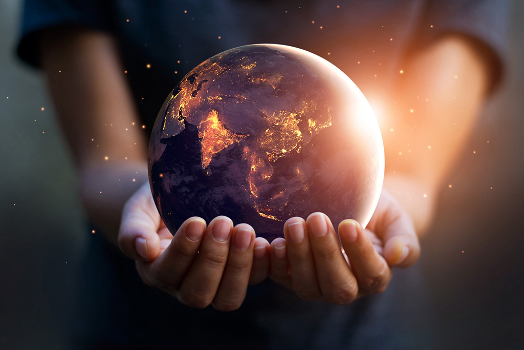 person holding earth wondering about our purpose on earth