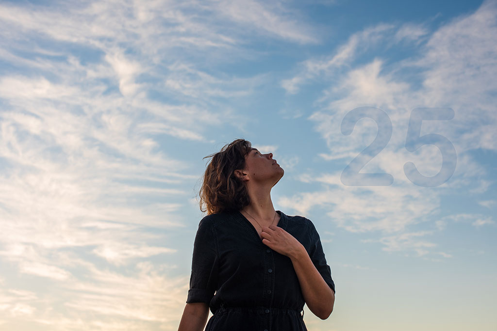Woman looks to the sky for answers