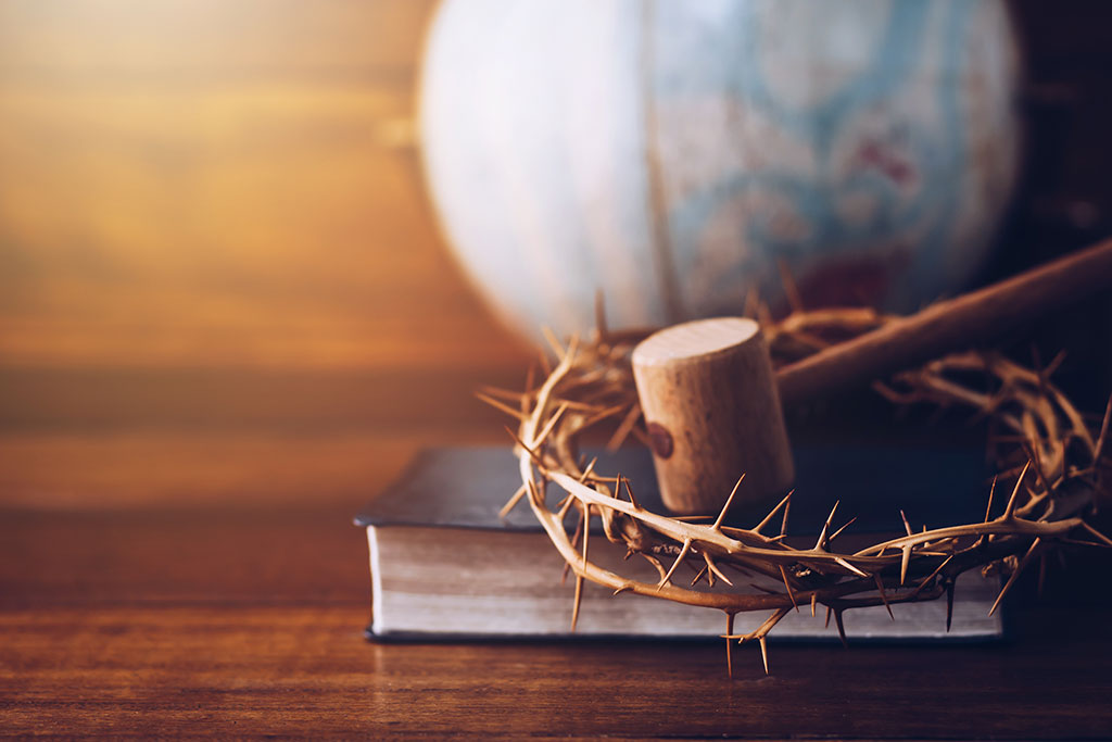 Gavel on a Bible with crown of thorns