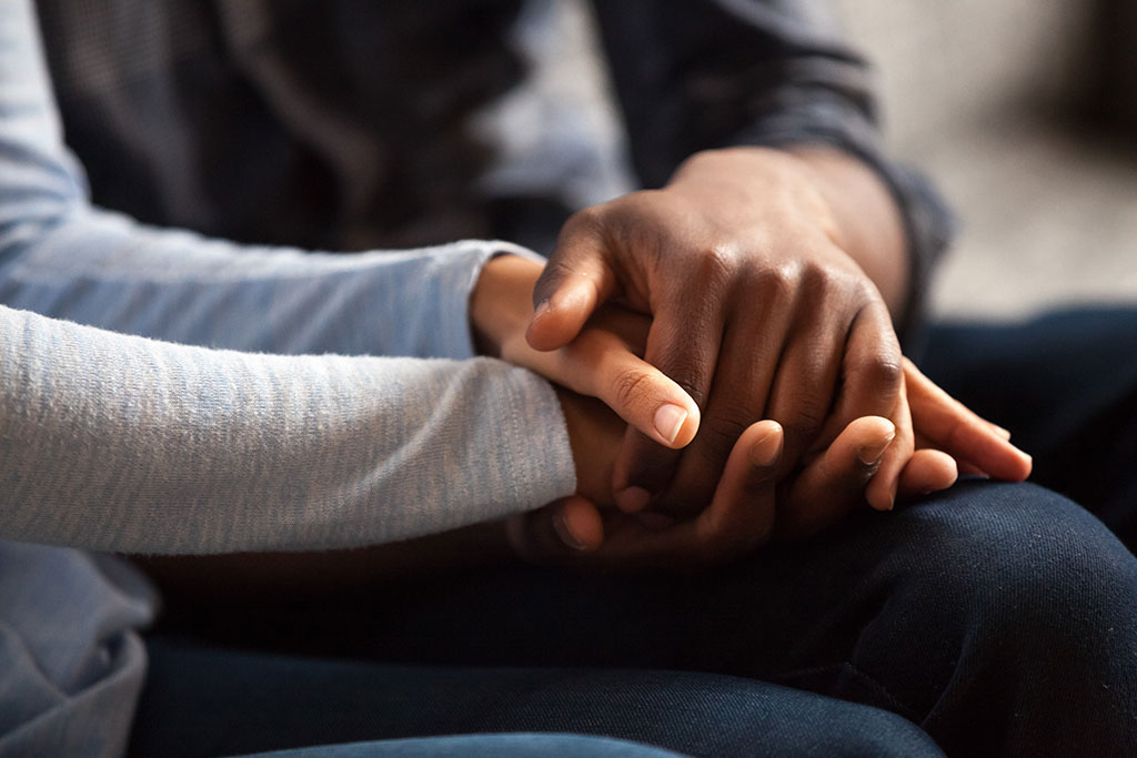Hands folded on each other in relationship